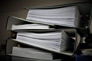 stacks of jurisdictional paperwork regarding fire inspections in denver